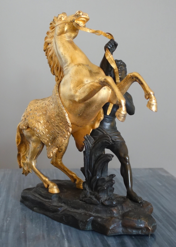 Cheval de Marly groupe en bronze patiné et doré au mercure d'après Coustou début XIXe siècle