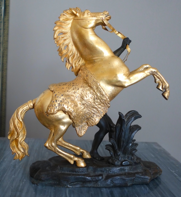 Cheval de Marly groupe en bronze patiné et doré au mercure d'après Coustou début XIXe siècle