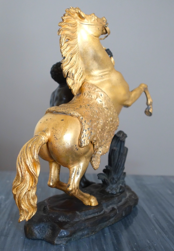 Cheval de Marly groupe en bronze patiné et doré au mercure d'après Coustou début XIXe siècle