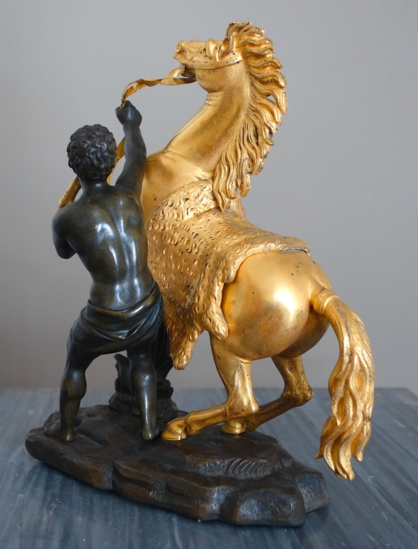 Cheval de Marly groupe en bronze patiné et doré au mercure d'après Coustou début XIXe siècle