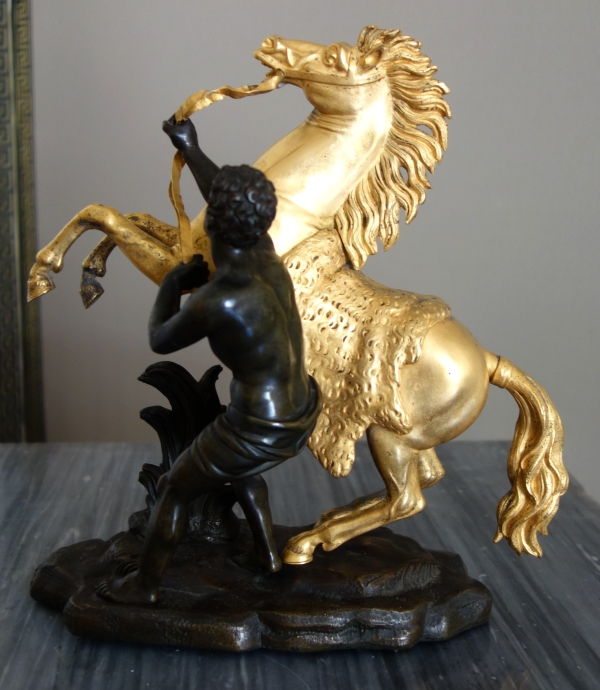 Cheval de Marly groupe en bronze patiné et doré au mercure d'après Coustou début XIXe siècle