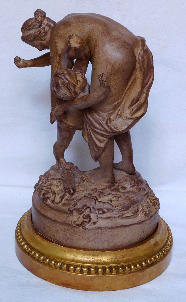 Venus gives Love a smack on the bottom, terra cotta, early 20th century