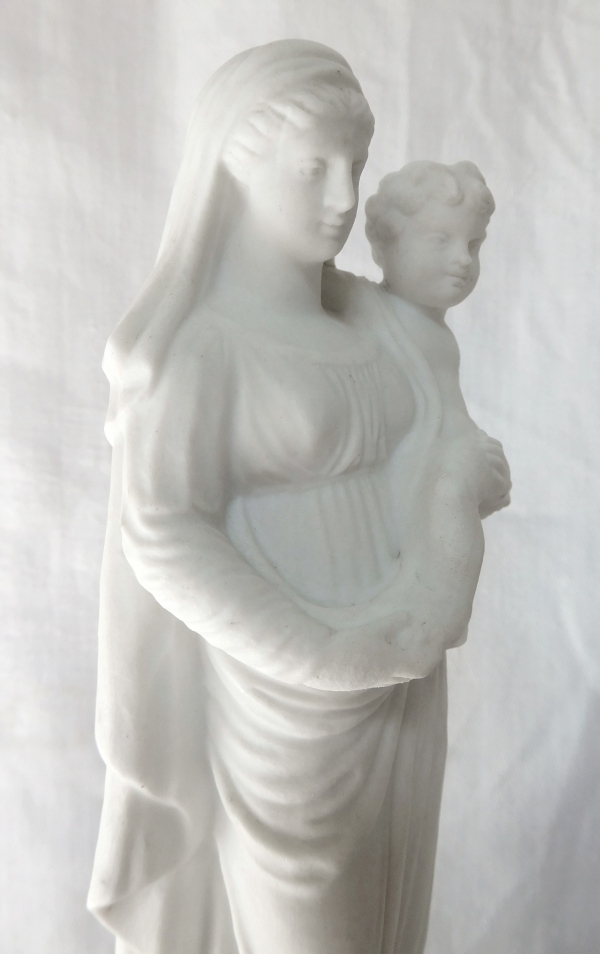 Early 19th century gilt porcelain and biscuit Virgin and Child