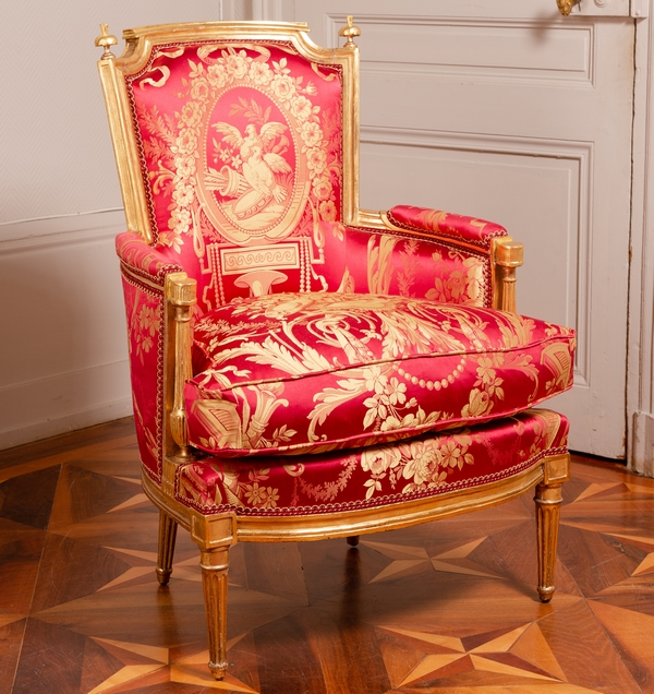 Louis XVI wing chair gilt with gold leaf, late 18th century, Tassinari & Chatel silk fabric