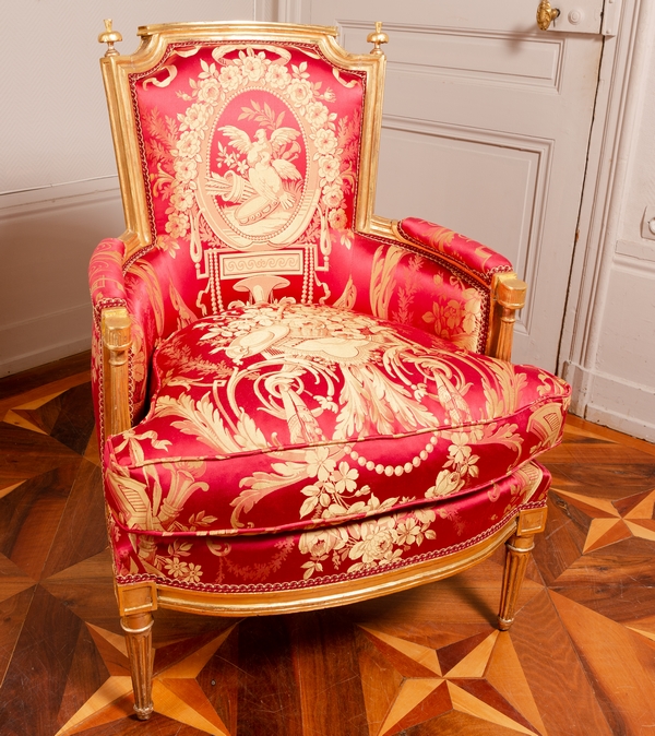 Louis XVI wing chair gilt with gold leaf, late 18th century, Tassinari & Chatel silk fabric