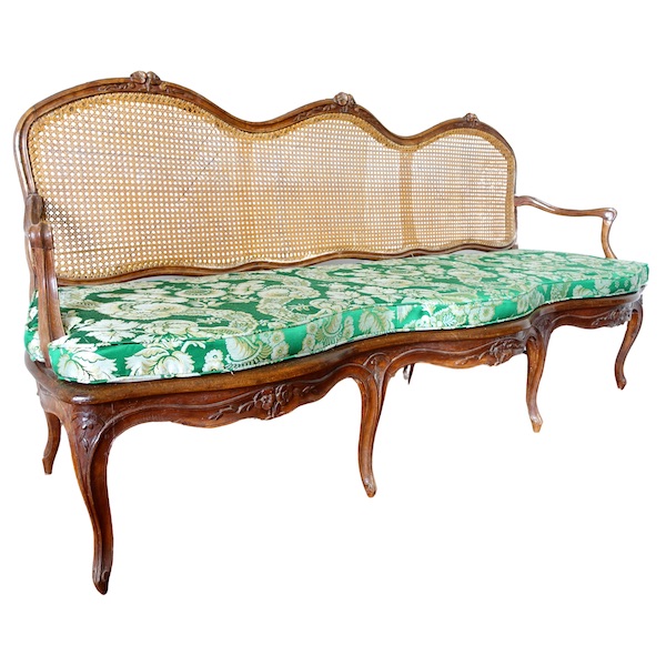 Louis XV walnut canned sofa, 18th century