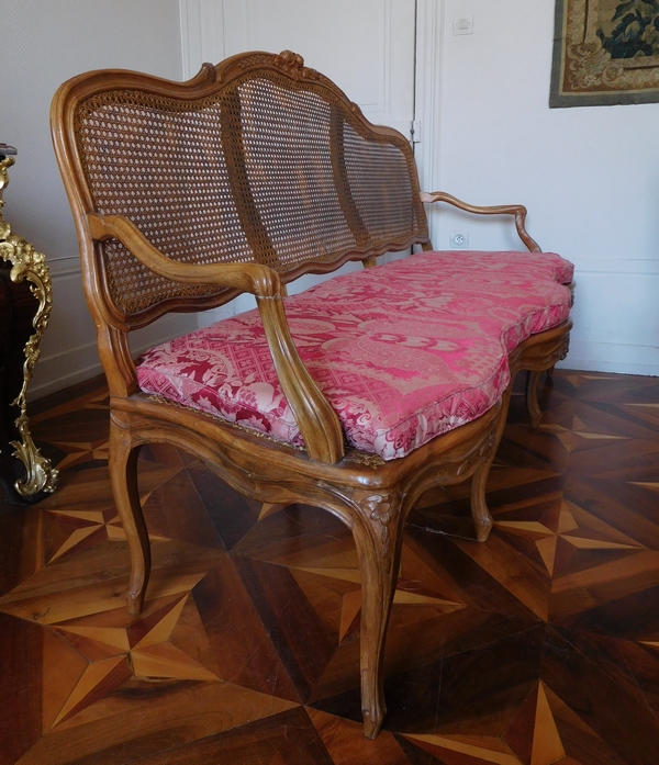 Canned walnut sofa / bench, Louis XV production - 18th century