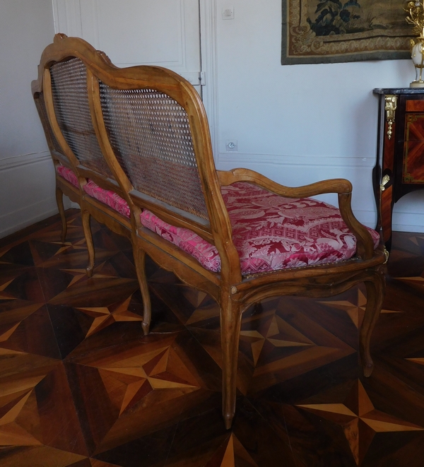 Canned walnut sofa / bench, Louis XV production - 18th century