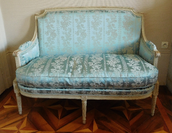 Louis XVI sofa for 2 persons, lacquered wood and blue silk, 18th century