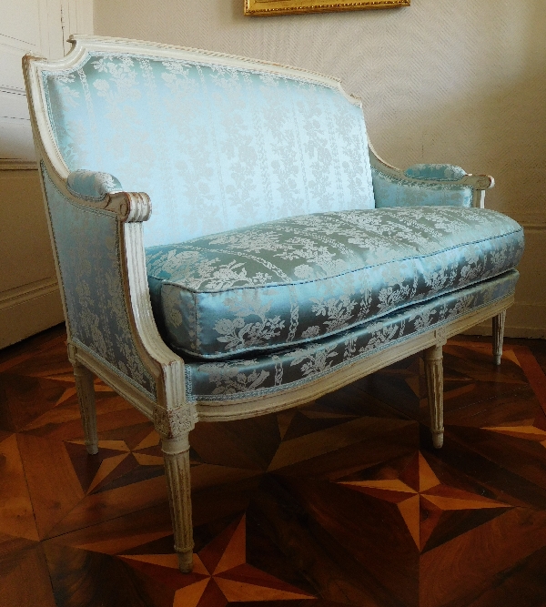 Louis XVI sofa for 2 persons, lacquered wood and blue silk, 18th century