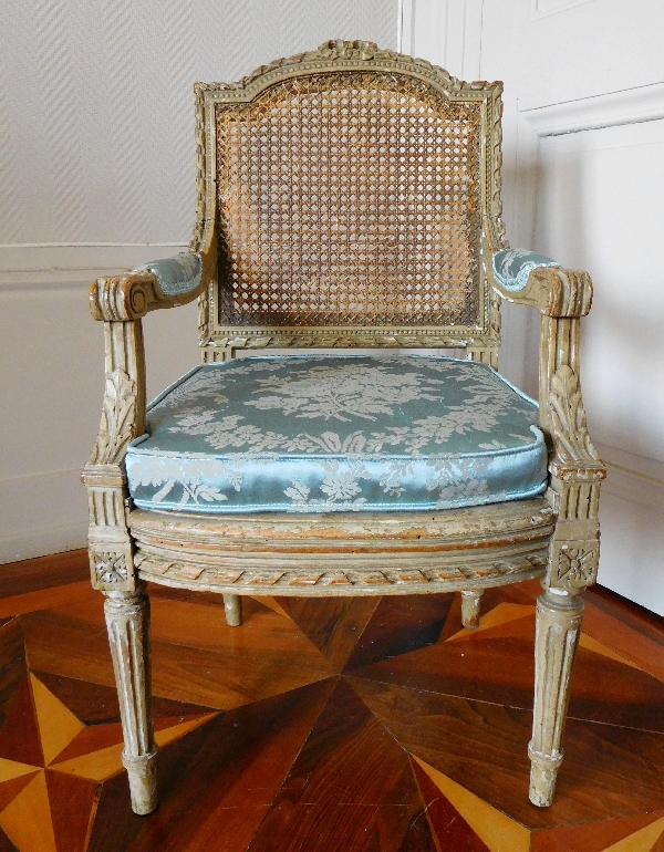 Caned Louis XVI style armchair for a child, silk cushion, 19th century