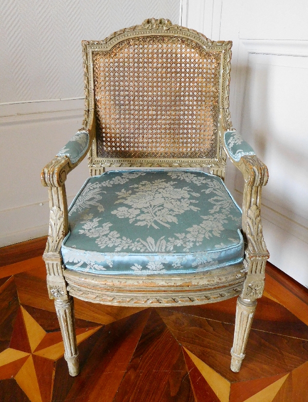 Caned Louis XVI style armchair for a child, silk cushion, 19th century