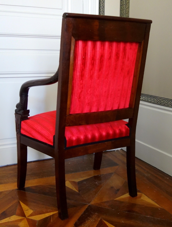 Empire mahogany armchair, dolphin-shaped armrests, early 19th century