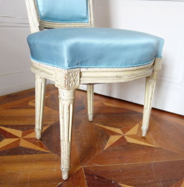 Pair of Louis XVI lacquered cabriolet chairs, light blue silk cover