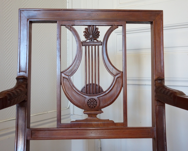 Pair of Directoire mahogany armchairs, lyra-shaped backrest, late 18th century