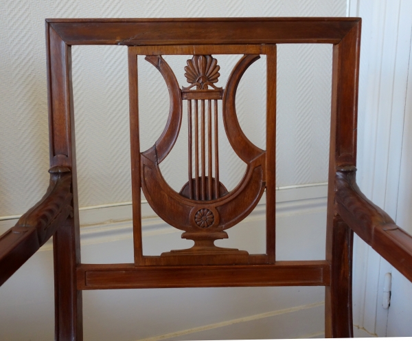 Pair of Directoire mahogany armchairs, lyra-shaped backrest, late 18th century