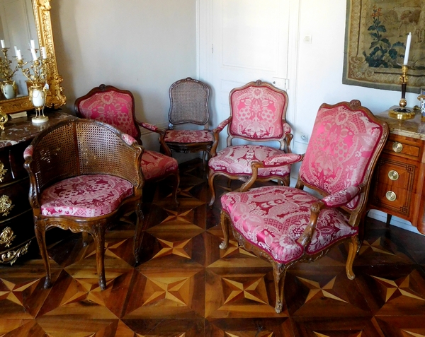 Pair of a la Reine Louis XV walnut armchairs, mid-18th century