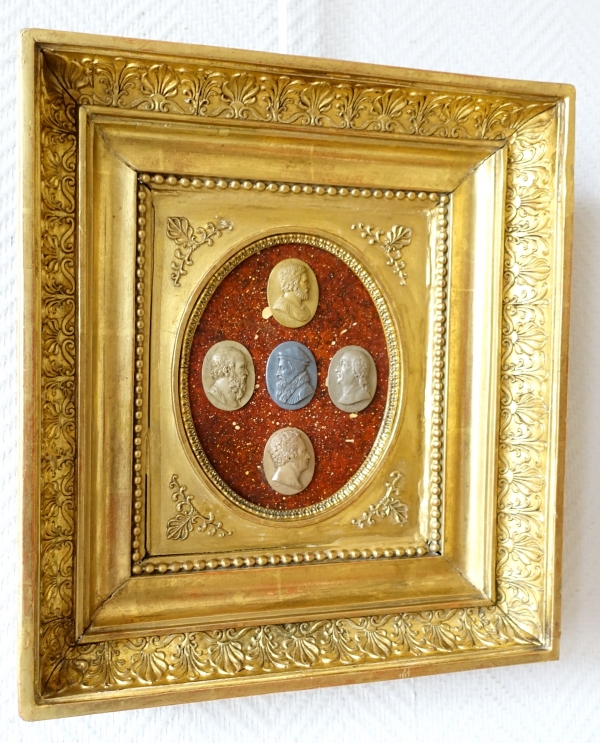 Antique cameos on a porphyry background, gilt wood frame - early 19th century