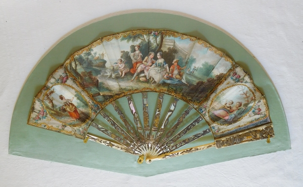 Louis XVI mother of pearl and gouache fan set into its gilt wood frame box