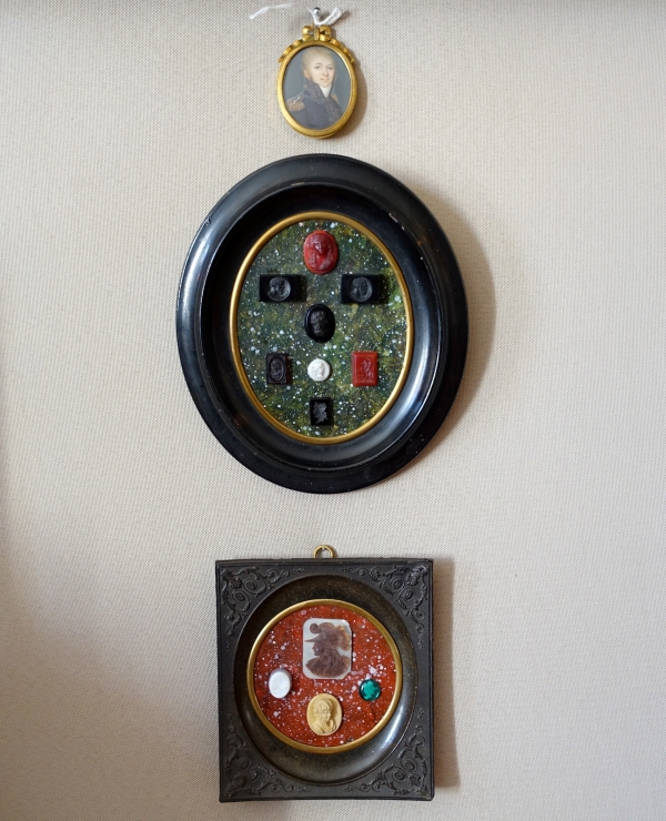 Etched semi precious stones collection on a porphyry background, 19th century
