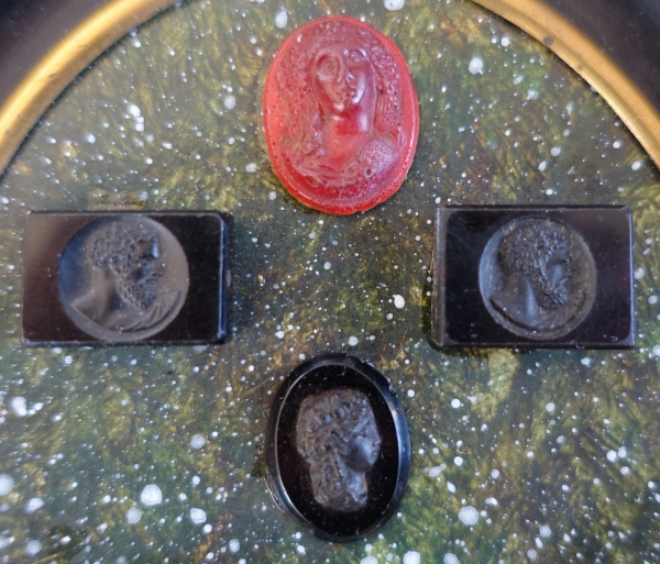 Etched semi precious stones collection on a porphyry background, 19th century