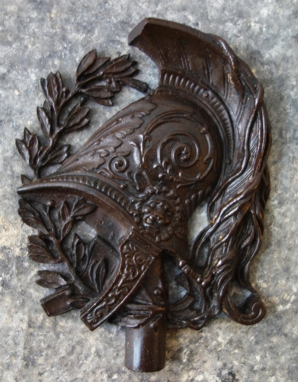 Large miniature, patinated bronze military trophee on a granite background