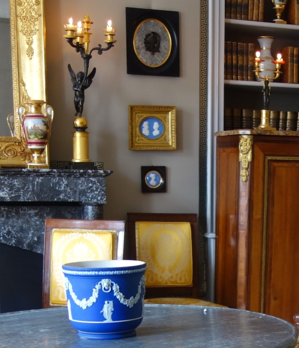 Large miniature, patinated bronze military trophee on a granite background