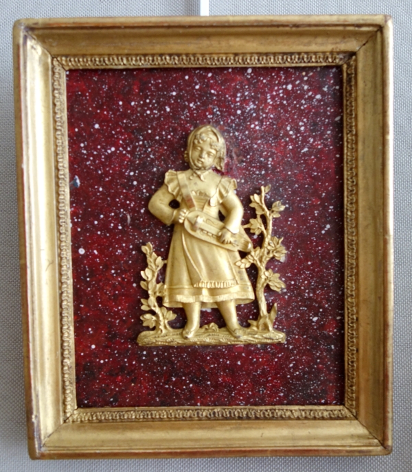 Paire de médaillons miniatures en bronze doré au mercure, fond faux porphyre - début XIXe siècle