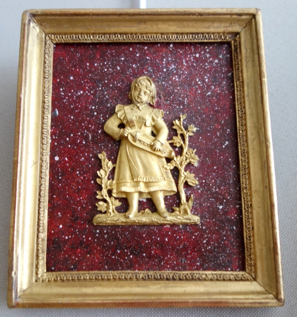 Paire de médaillons miniatures en bronze doré au mercure, fond faux porphyre - début XIXe siècle