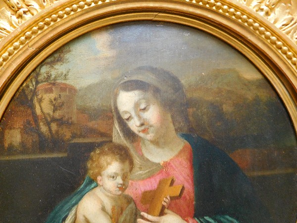 17th or 18th century school : Virgin and Child, oil on panel set into a circular gilt wood frame