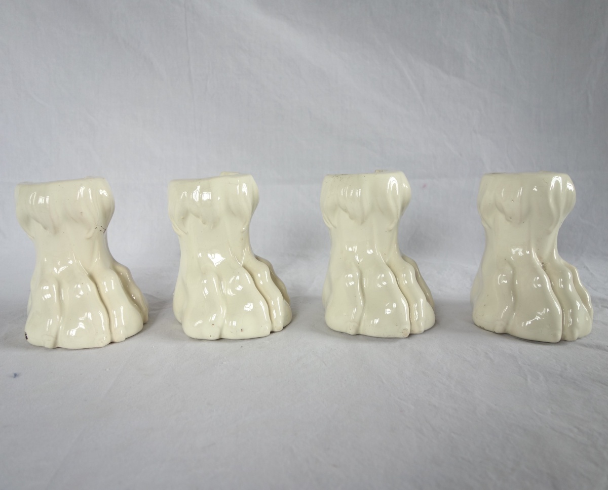 Detail — 4 ornamental lion claws feet for a earthenware wood-burner stove