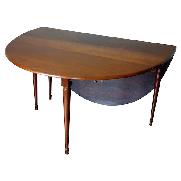 Jean François Leleu : table pliante gateleg en acajou massif d'époque Louis XVI