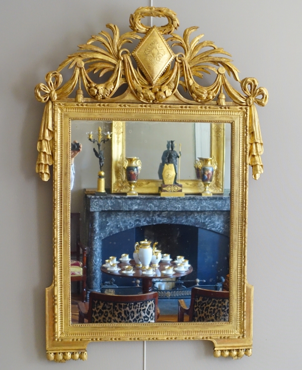 Detail — Large gold leaf gilt wood Louis XVI mirror, 18th century