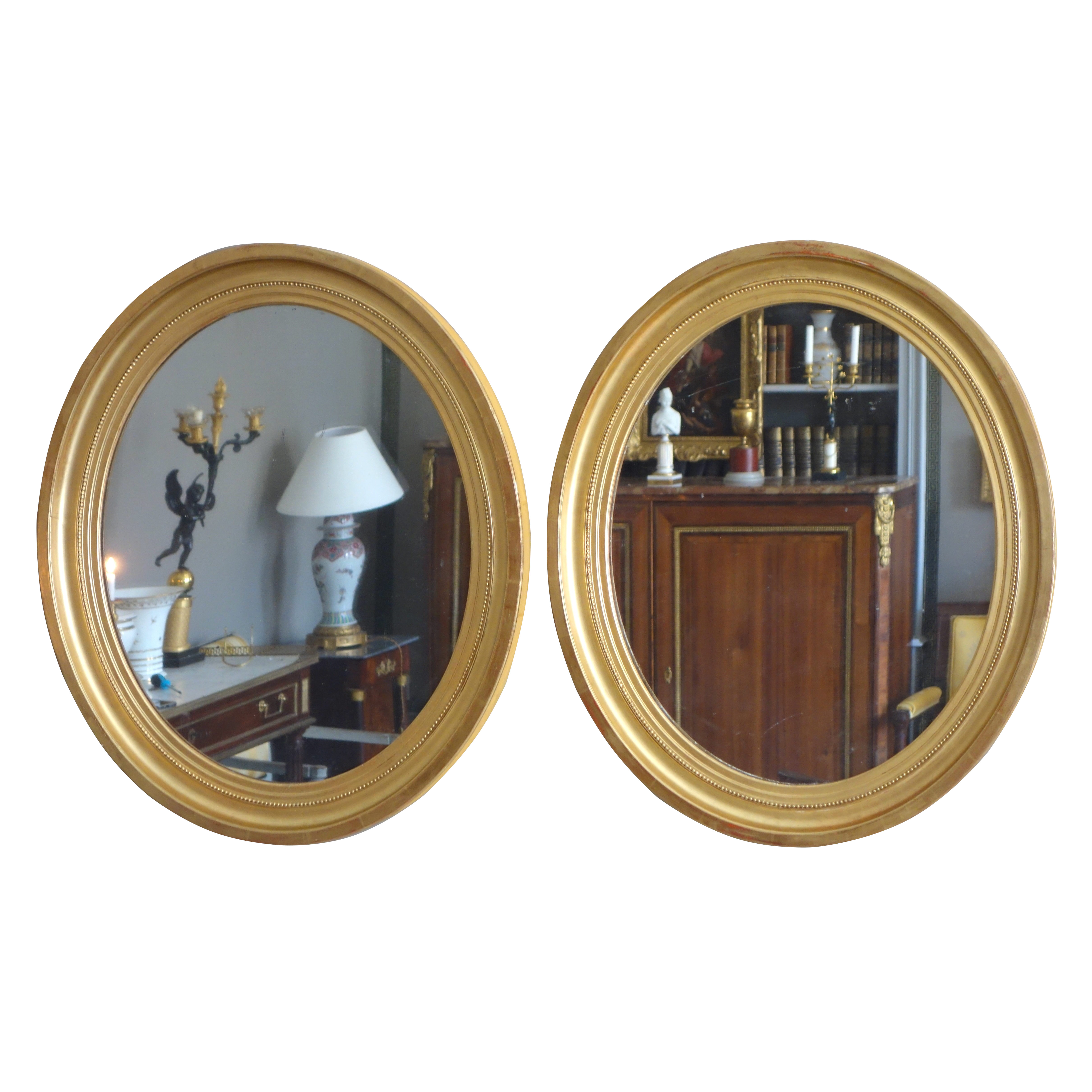 Pair of tall Louis XVI style oval mirrors, gold leaf gild wood frame, mercury glass