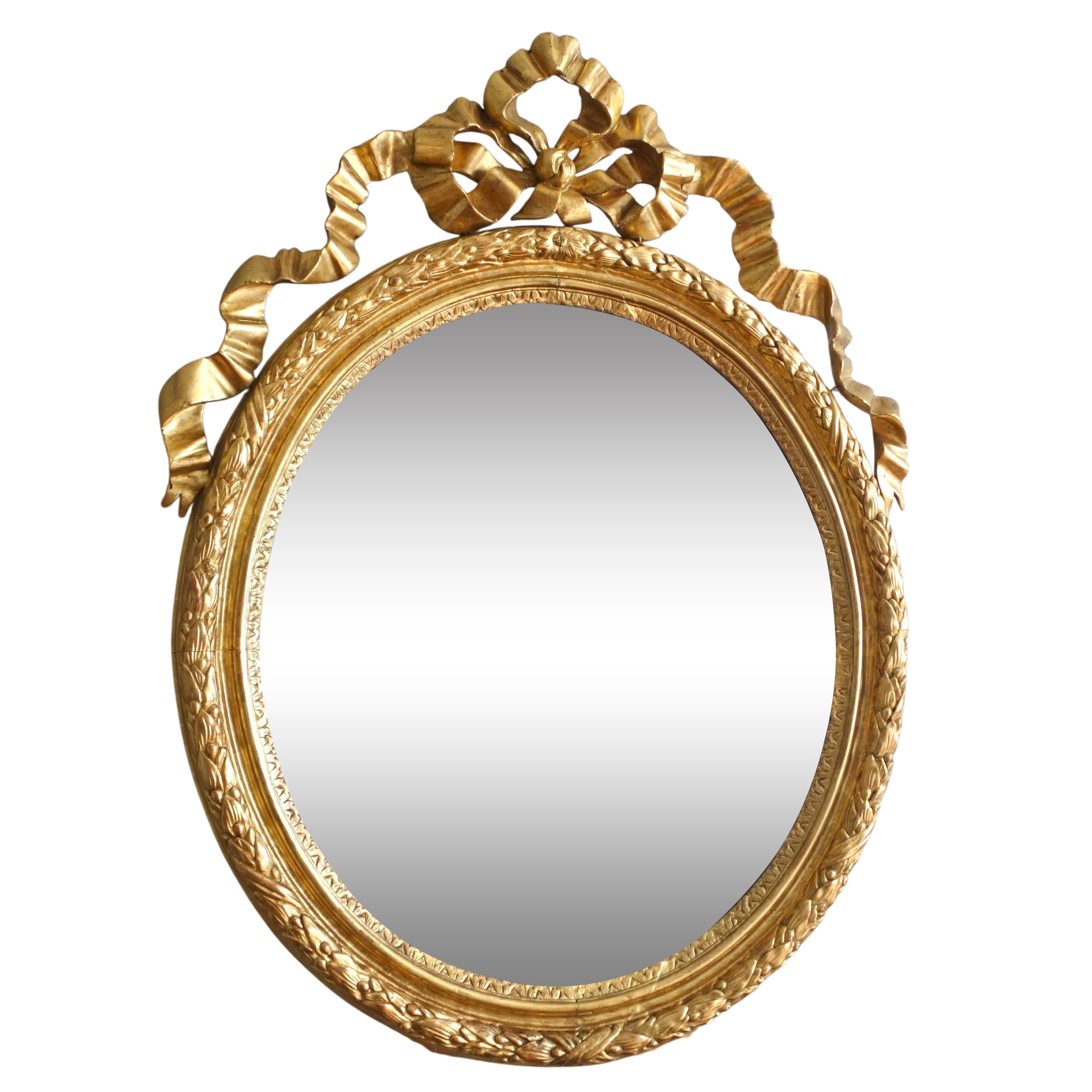 Louis XVI gold leaf gilt wood oval mirror, 18th century circa 1780