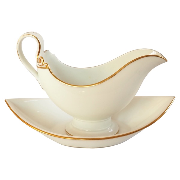 Nast : saucière d’époque Empire en porcelaine de Paris blanche et or