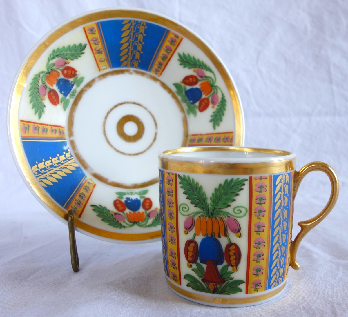 Detail — Empire gilt Paris porcelain and polychromatic biscuit coffee cup, early 19th century