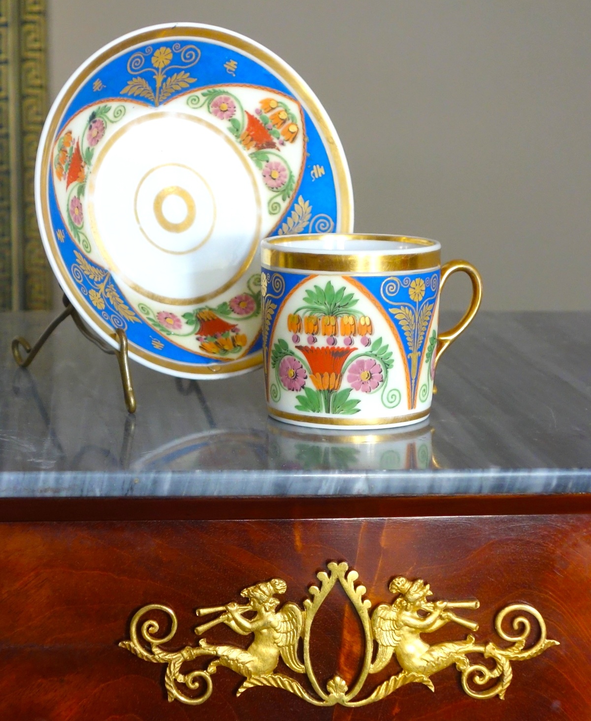 Detail — Empire gilt Paris porcelain and polychromatic biscuit coffee cup, early 19th century