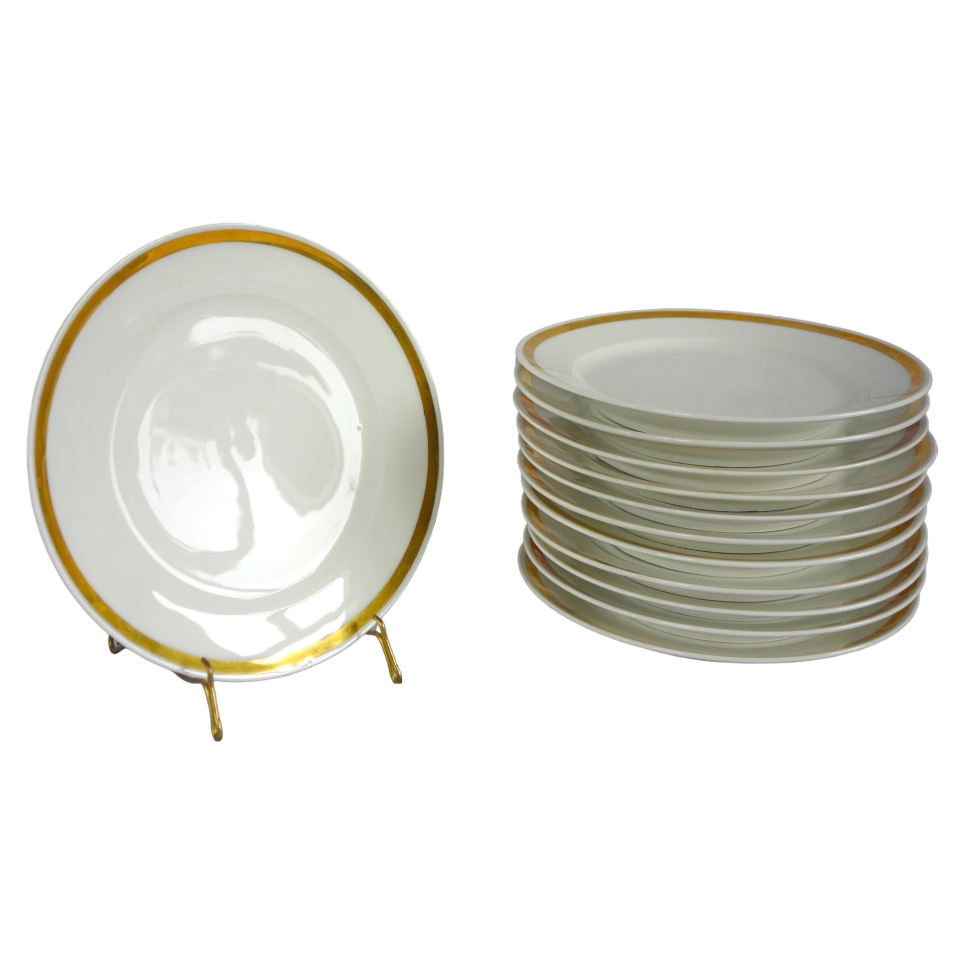 Série de 12 assiettes à dessert en porcelaine de Paris à large filet or, début XIXe siècle