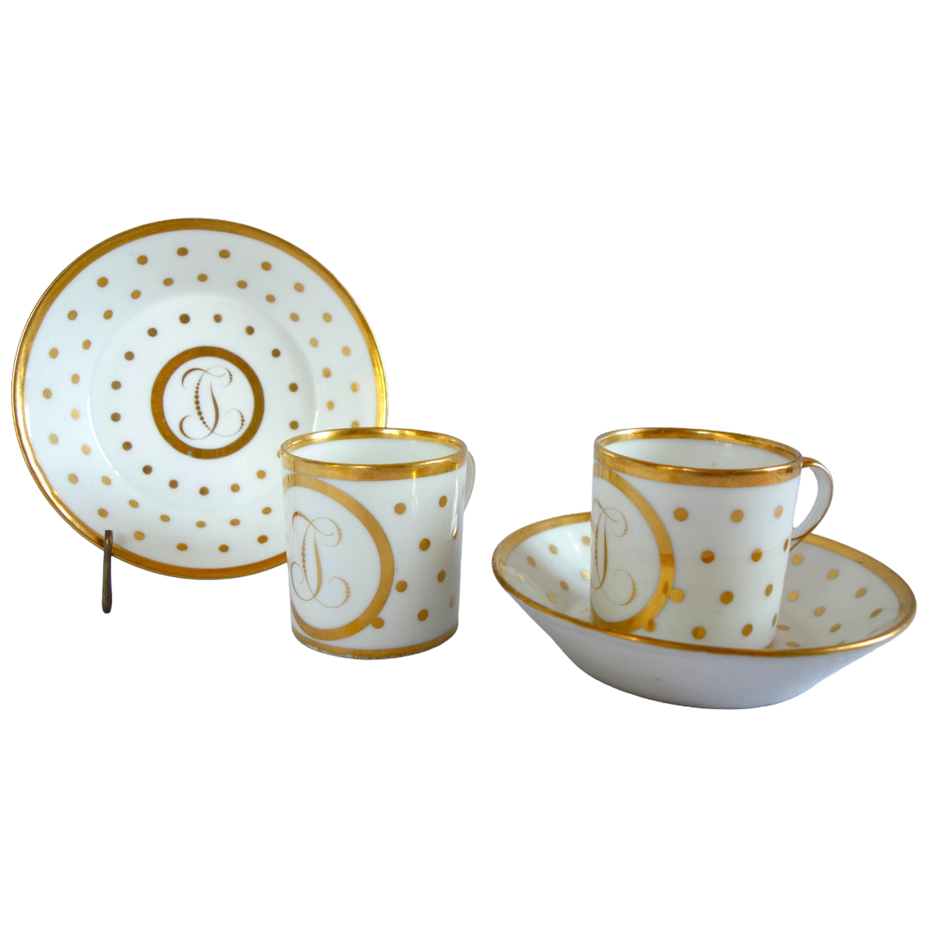 Pair of Paris porcelain coffee cups enhanced with fine gold, Empire period