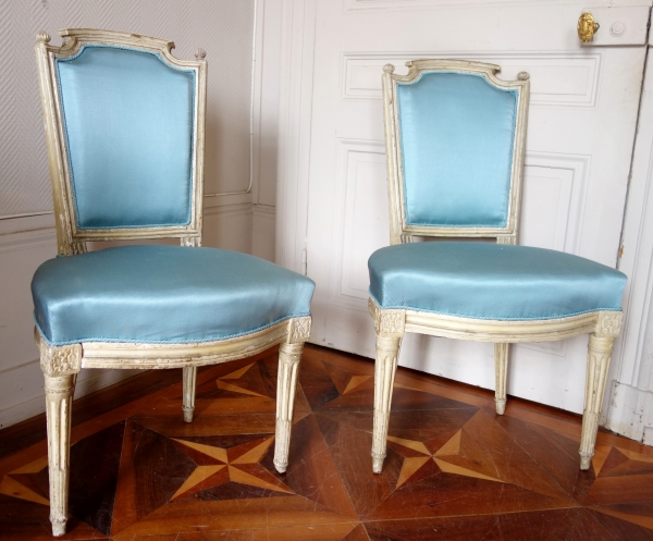 Detail — Pair of Louis XVI lacquered cabriolet chairs, light blue silk cover